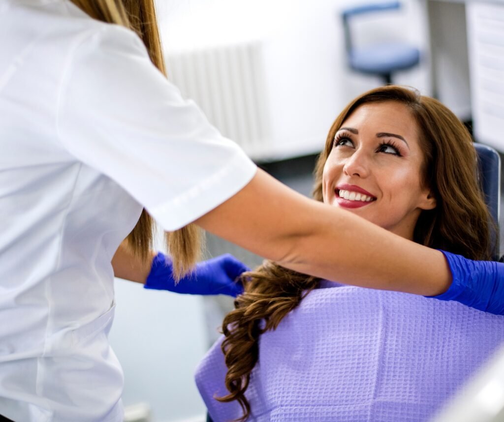 Nervous patient overcoming dental anxiety with the help of dental sedation during a stress-free dental procedure.